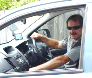 Picture of Dave in ute with sunglasses