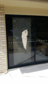 Broken glass on grey tinted glass